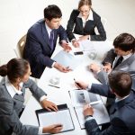 Business meetings – a thing of the past and is it normal to continue working during them?